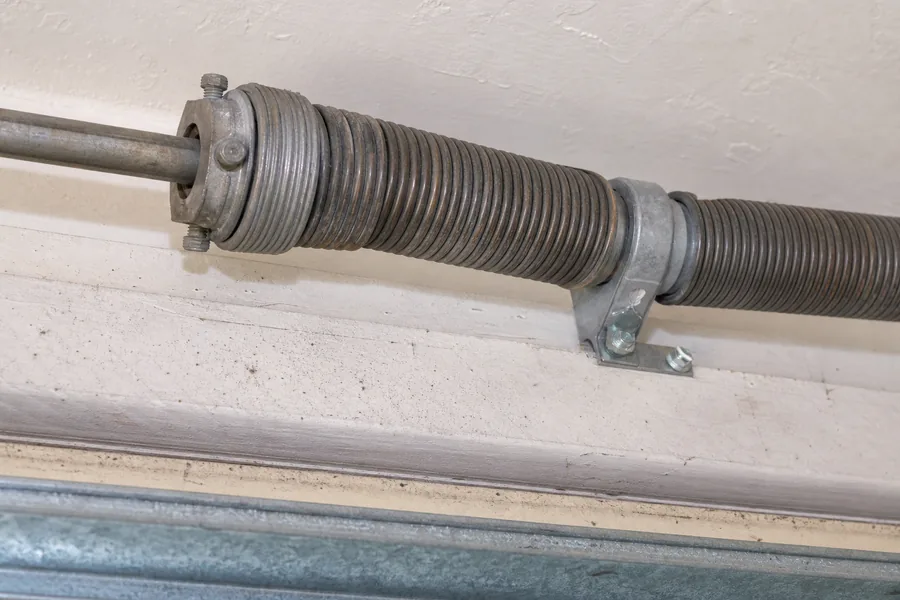 Torsion spring, winding cone and center bearing above a garage door in Denver, CO