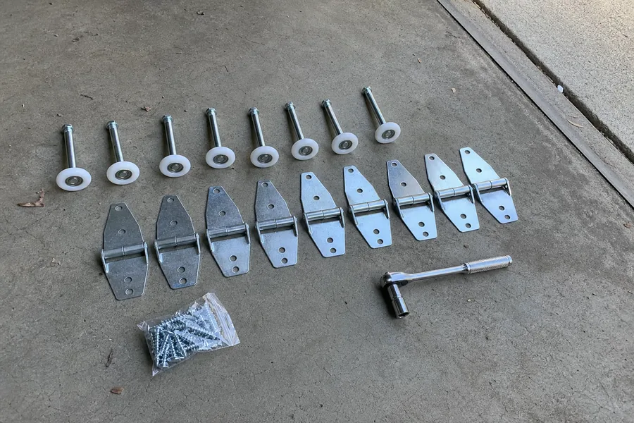 New rollers and hinges ready for a garage door in Denver, CO