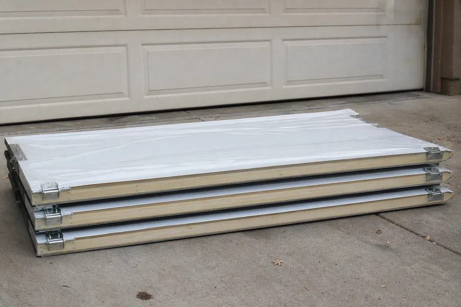New insulated door sections on the driveway in Denver, CO