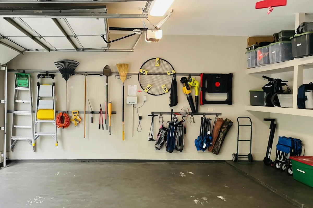 Tidy garage interior with tools hung on the wall